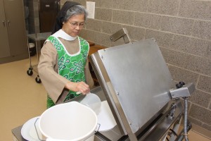 Sr. Maria Eden baking on the stove, Raphael